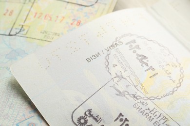 MYKOLAIV, UKRAINE - FEBRUARY 23, 2022: Passport pages with different visa stamps, closeup
