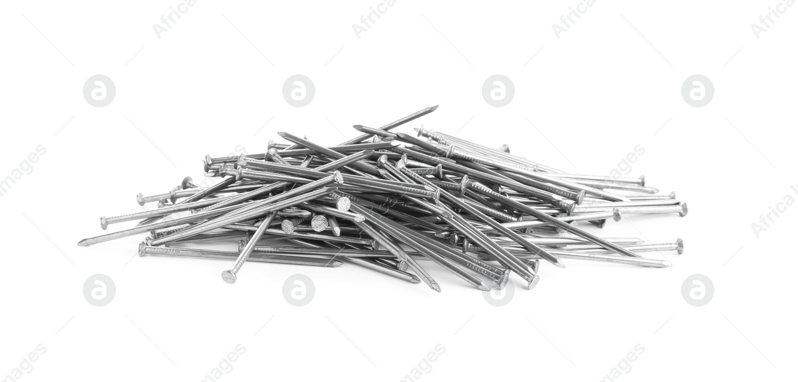 Photo of Pile of metal nails on white background