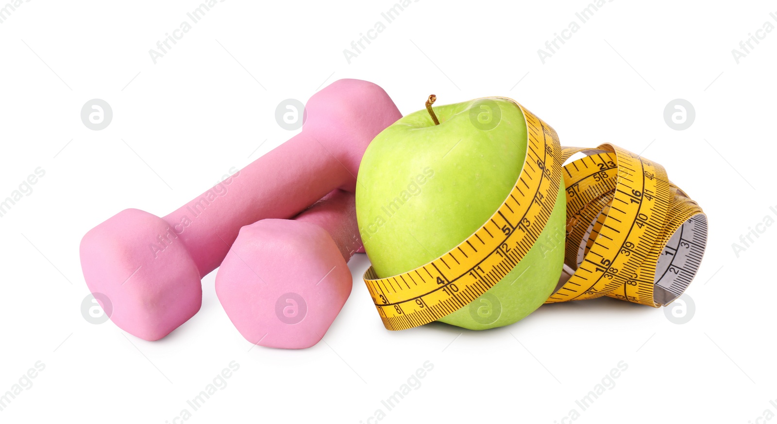 Photo of Dumbbells, apple and measuring tape isolated on white