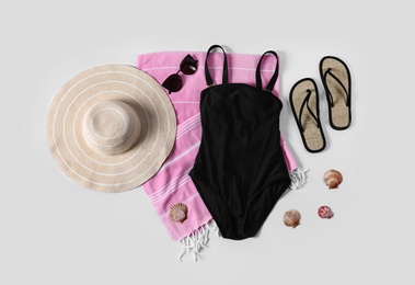 Photo of Flat lay composition with beach accessories on white background