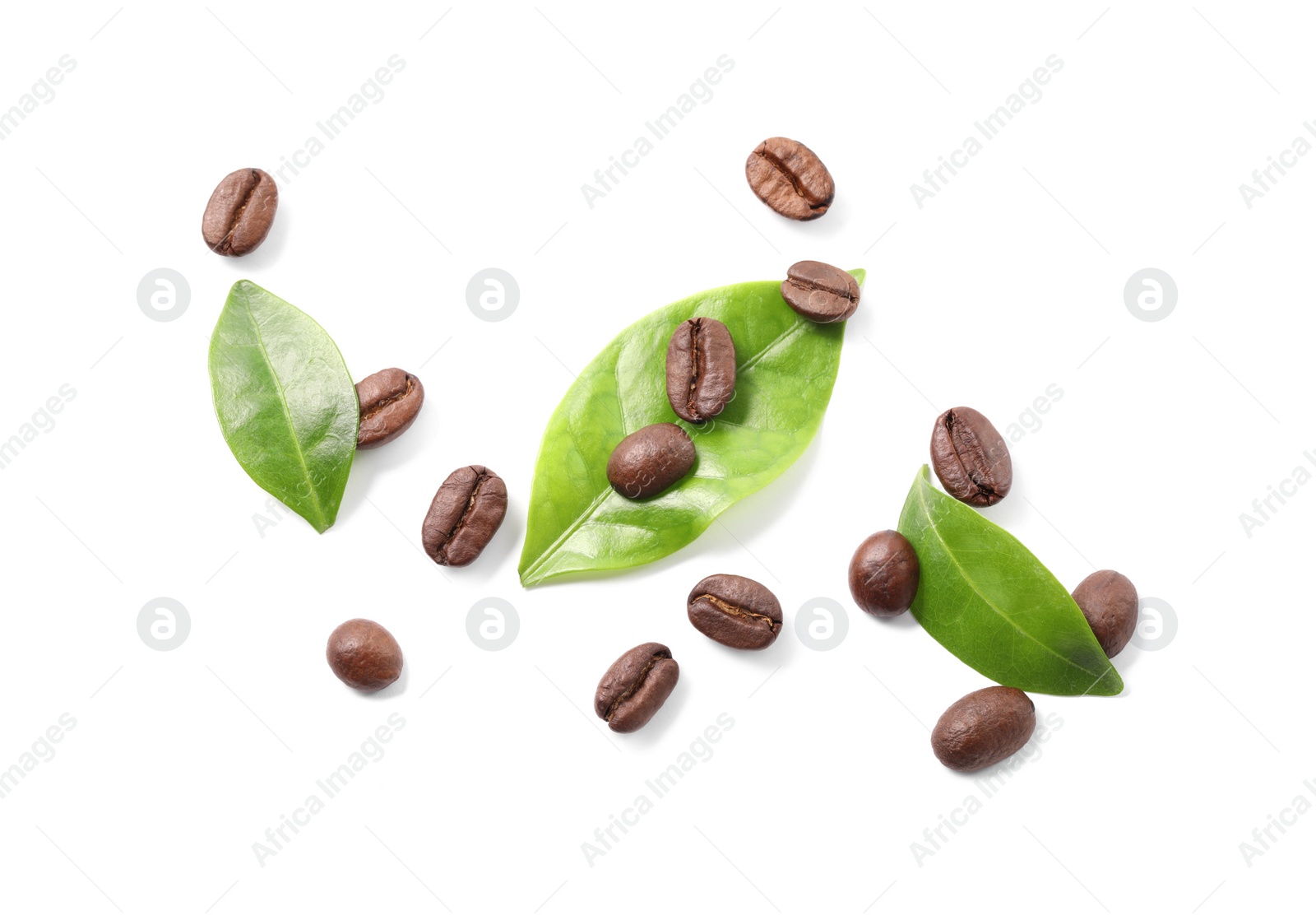 Photo of Roasted coffee beans and leaves isolated on white, top view