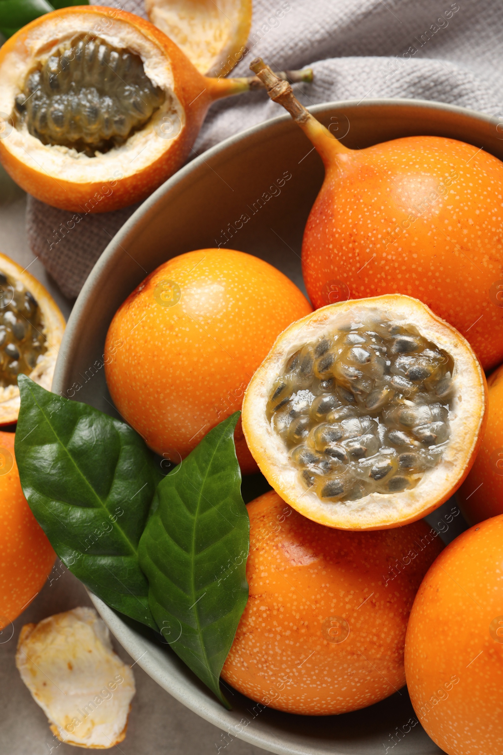 Photo of Delicious ripe granadillas on table, closeup view