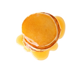 Stack of tasty pancakes with maple syrup on white background, top view