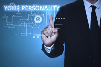 Image of Man pointing at phrase YOUR PERSONALITY on virtual screen against blue background, closeup 