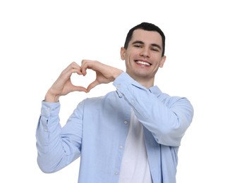 Man showing heart gesture with hands on white background