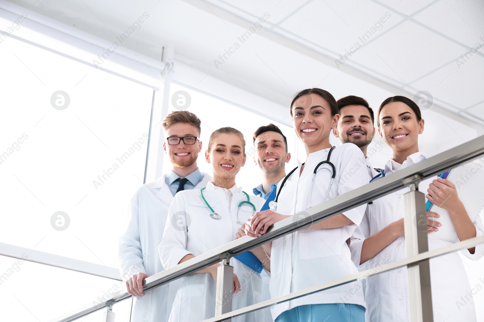 Photo of Group of medical doctors indoors. Unity concept