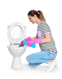 Photo of Woman cleaning toilet bowl in bathroom