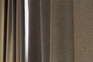 Beautiful light grey window curtains, closeup view