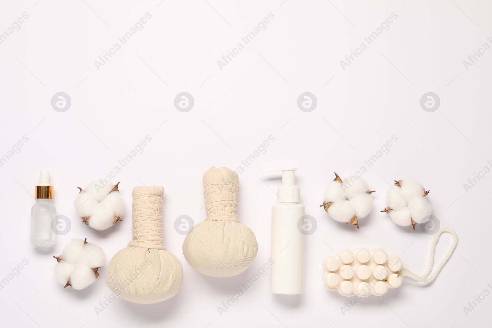 Photo of Bath accessories. Different personal care products and cotton flowers on white background, flat lay with space for text