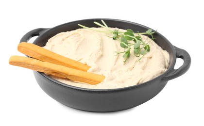 Delicious hummus with grissini sticks on white background