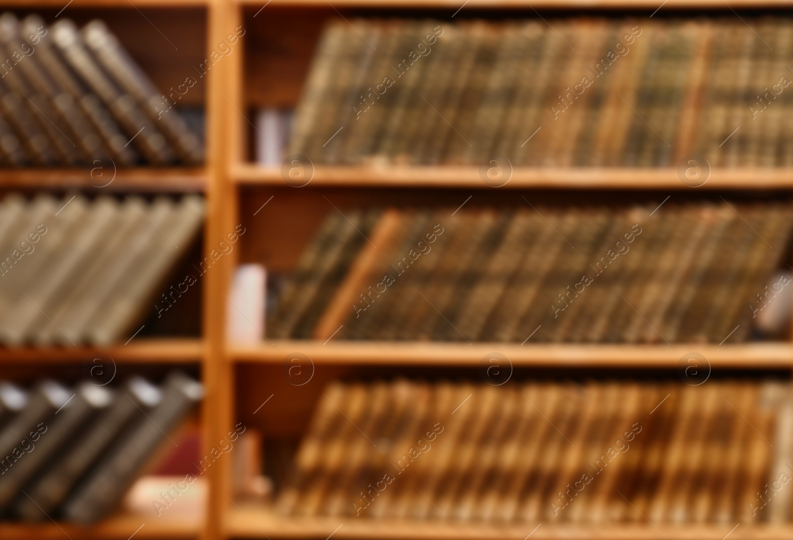 Photo of Blurred view of books on shelves in library