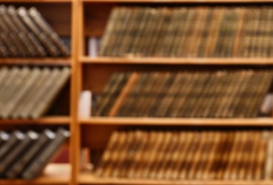 Blurred view of books on shelves in library