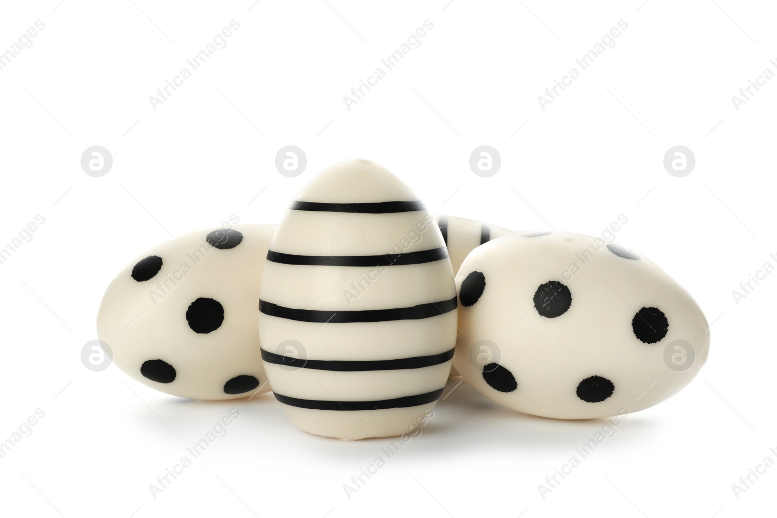 Photo of Set of traditional Easter eggs decorated with black paint on white background