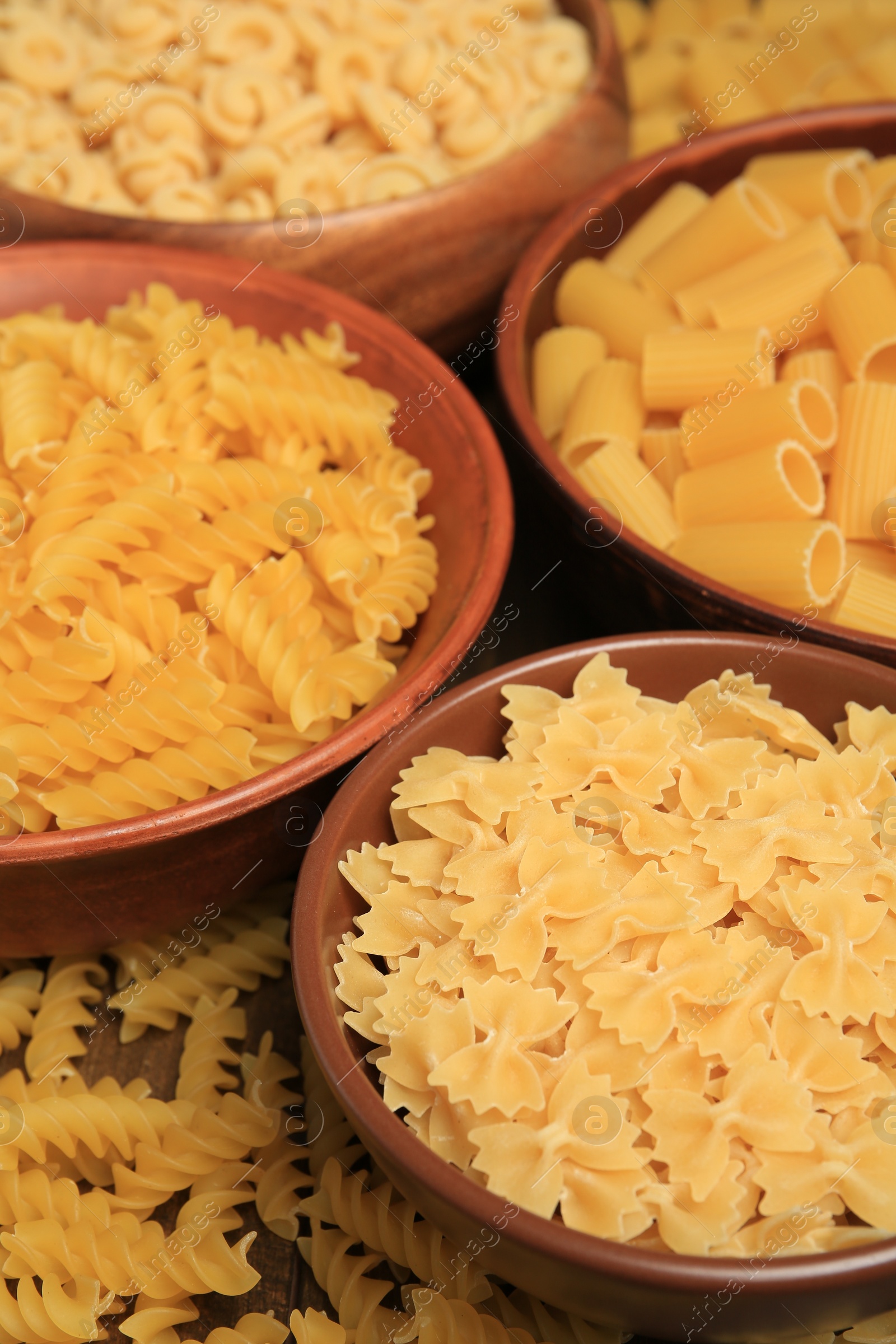 Photo of Different types of pasta on table, closeup