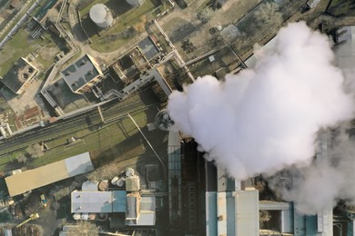 Polluting air with smoke, aerial view of industrial factory. CO2 emissions