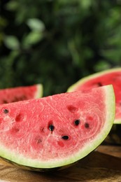 Photo of Delicious fresh watermelon slices on wooden table, closeup