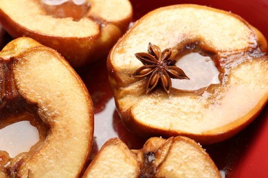 Photo of Tasty baked quinces with anise and honey in dish, closeup
