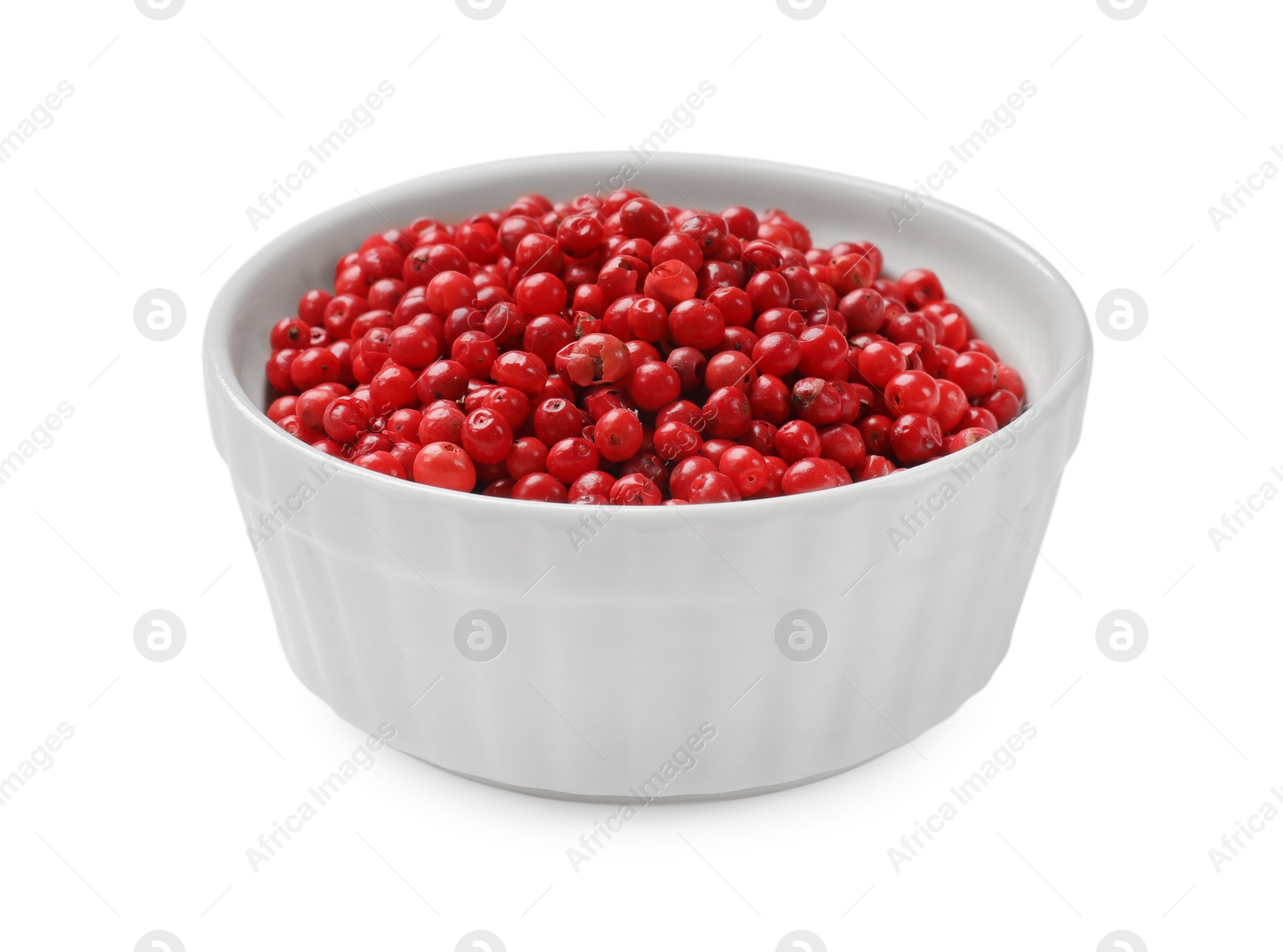 Photo of Aromatic spice. Red pepper in bowl isolated on white