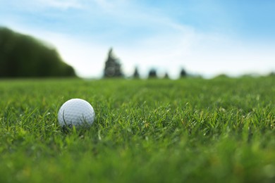 Photo of Golf ball on green course, space for text