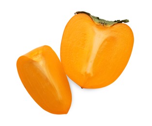 Cut delicious ripe juicy persimmon on white background, top view