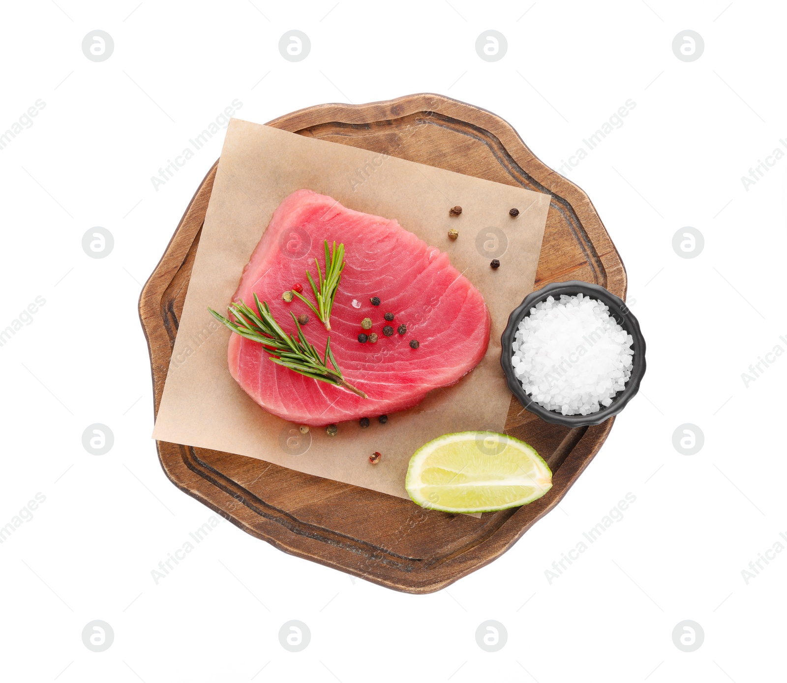 Photo of Raw tuna fillet with spices and lime wedge on white background, top view