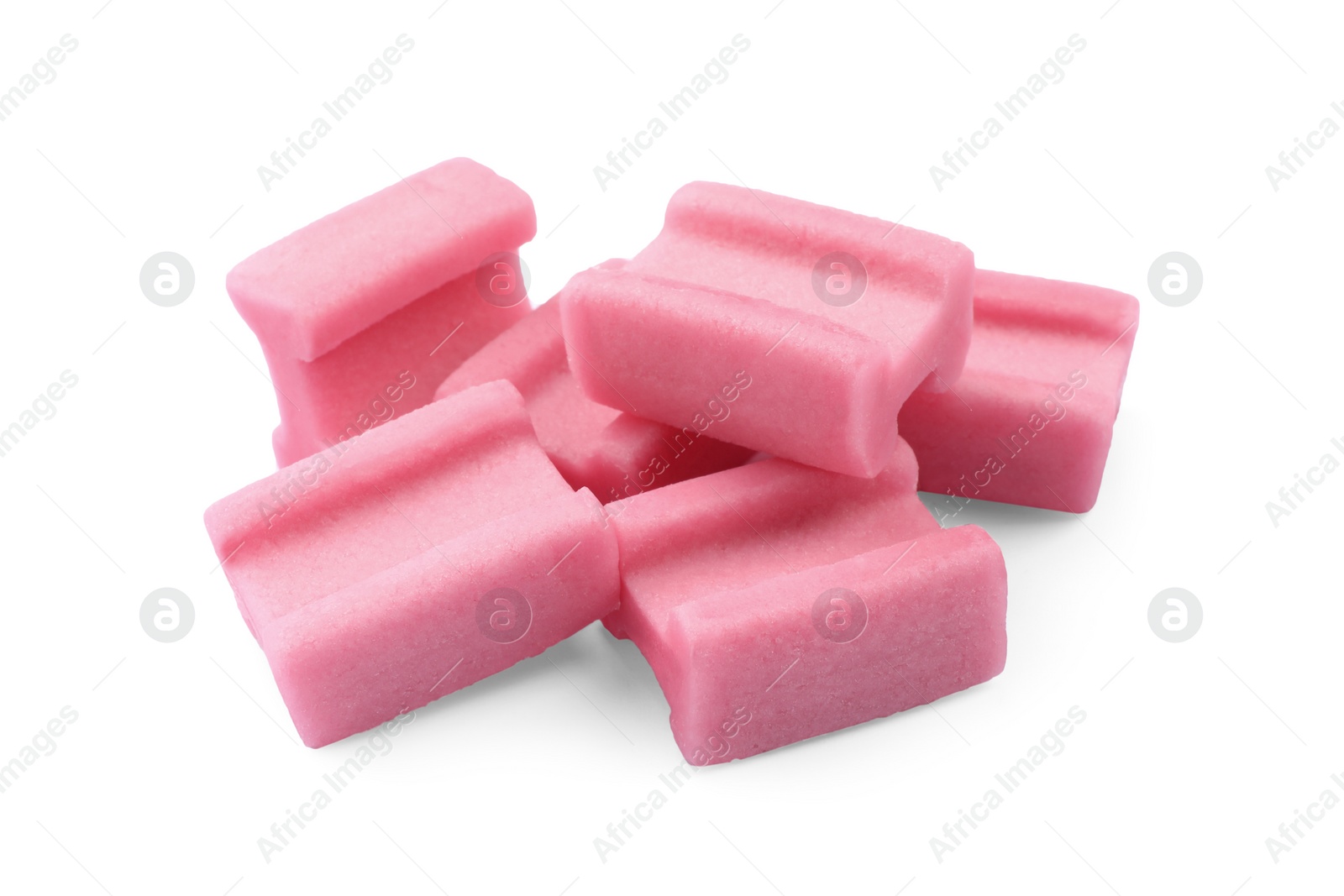 Photo of Many tasty pink chewing gums on white background