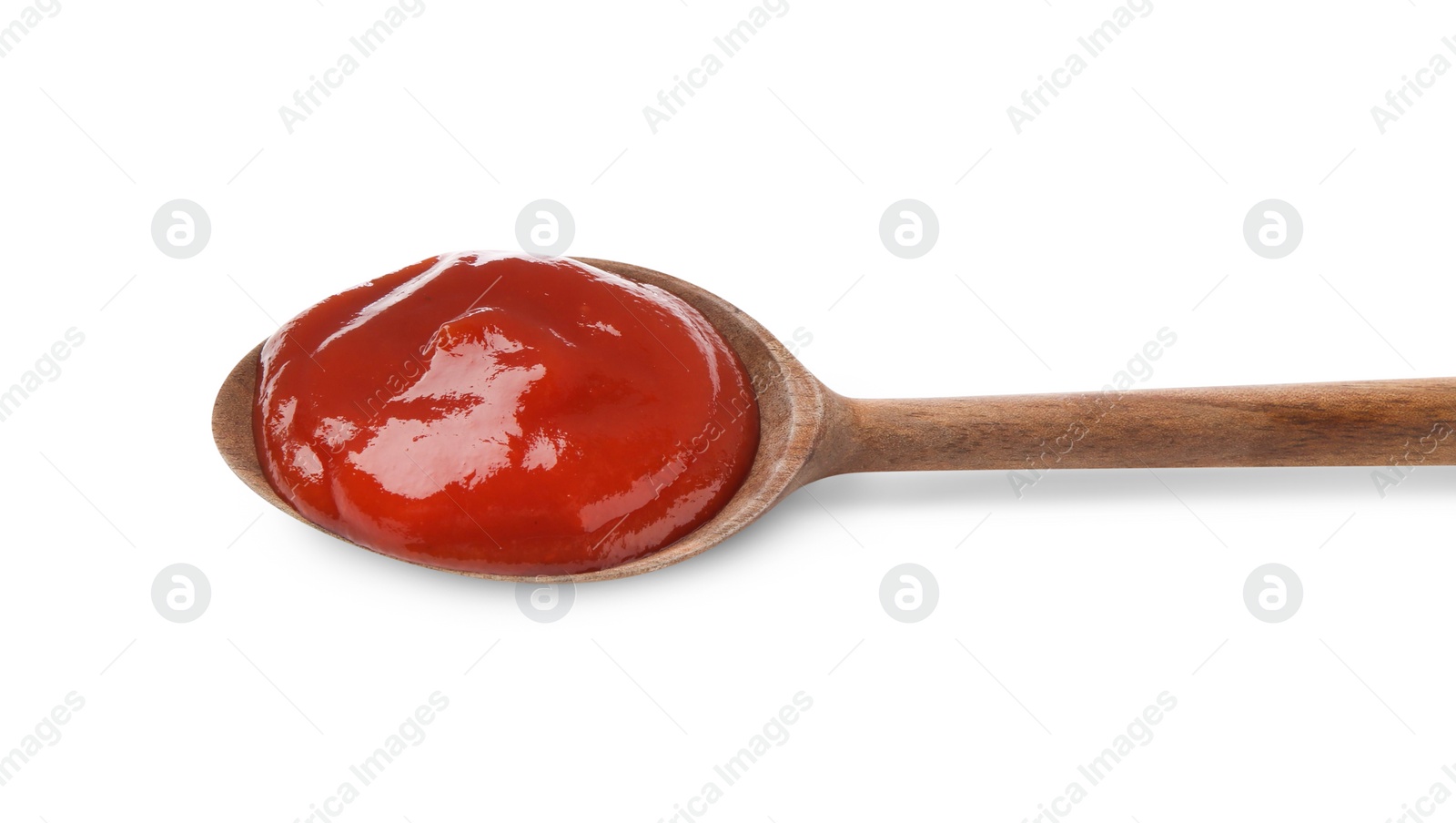 Photo of Tasty ketchup with wooden spoon isolated on white, top view. Tomato sauce