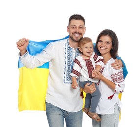 Photo of Happy family in national clothes with flag of Ukraine on white background