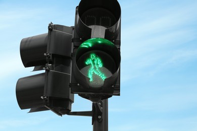 Photo of Traffic light for pedestrians on city street, closeup. Road rules
