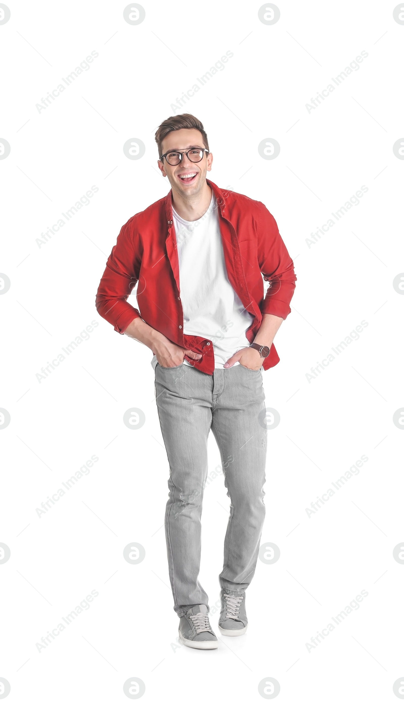 Photo of Handsome young man smiling on white background