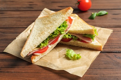 Photo of Tasty toast sandwiches on table. Wheat bread