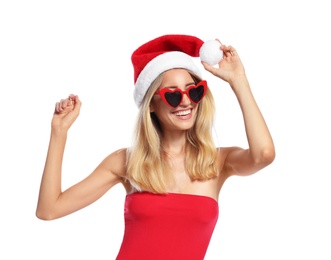 Photo of Young woman wearing Santa Claus hat on white background. Christmas vacation