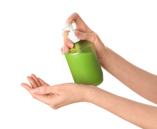 Photo of Woman holding soap dispenser on white background, closeup