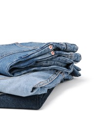 Image of Stack of different folded jeans isolated on white