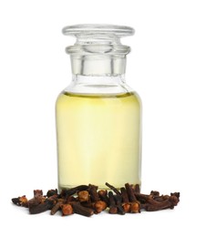 Essential oil and dried cloves on white background