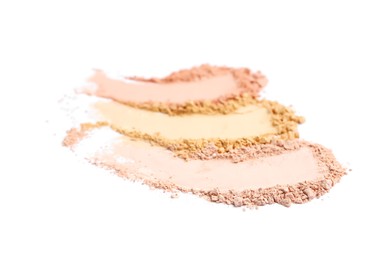 Photo of Swatches of different crushed face powders on white background