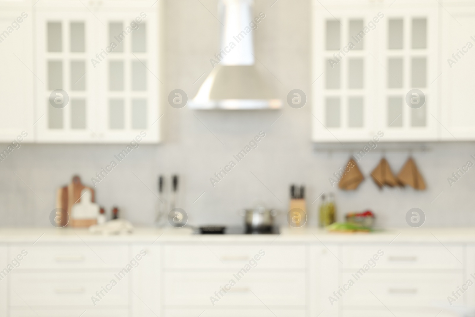 Photo of Blurred view of modern kitchen. Interior design