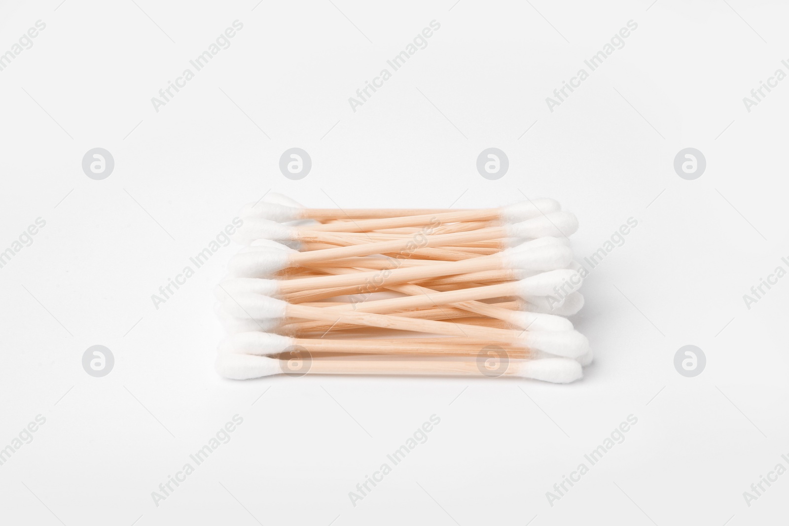 Photo of Pile of clean cotton buds isolated on white