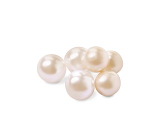 Photo of Many beautiful oyster pearls on white background