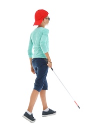 Photo of Blind boy with long cane walking on white background