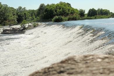 Photo of Fast river with rapids on sunny day