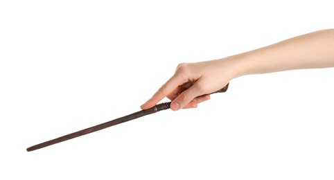 Woman holding wooden magic wand on white background, closeup