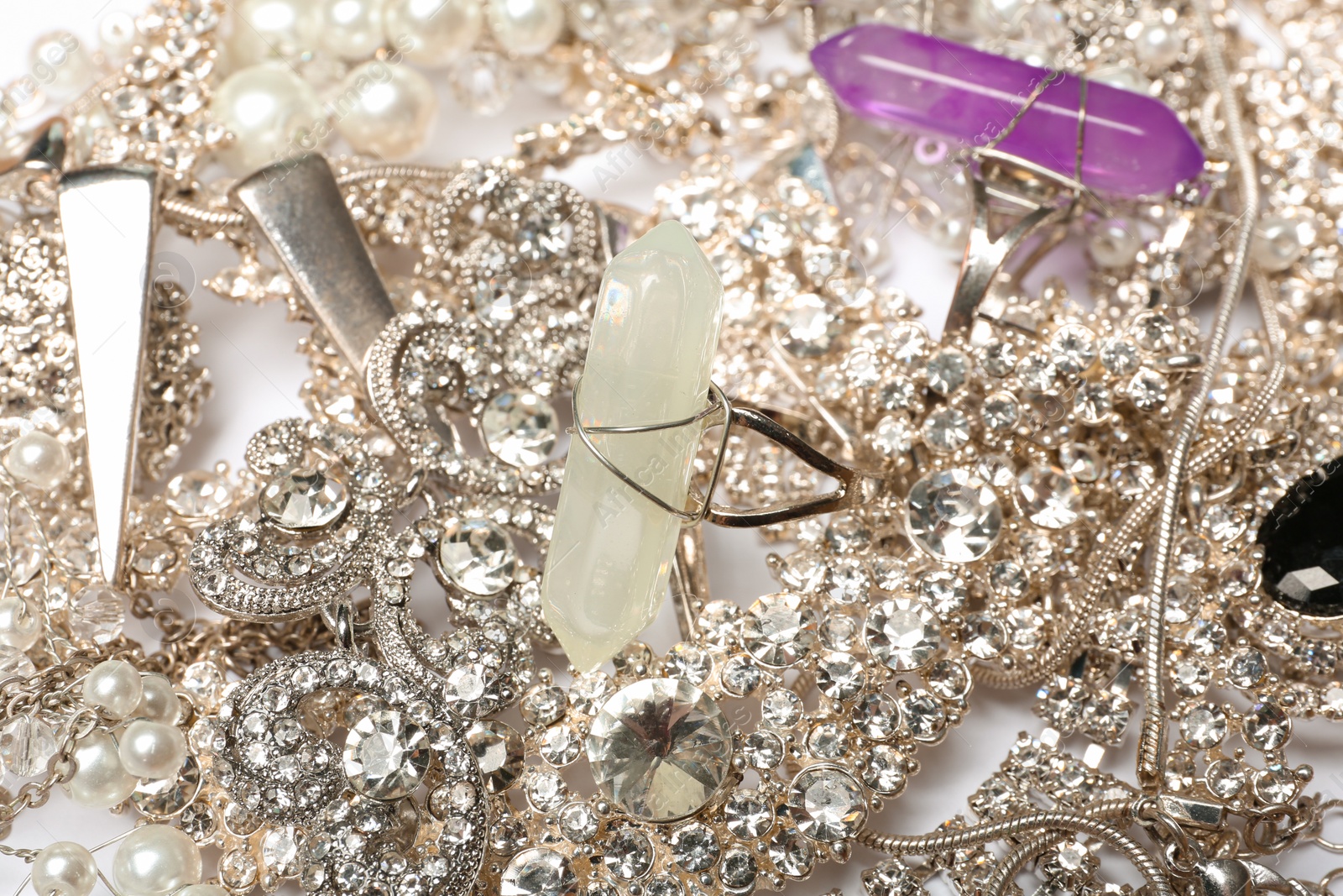 Photo of Different stylish jewelry as background, closeup view