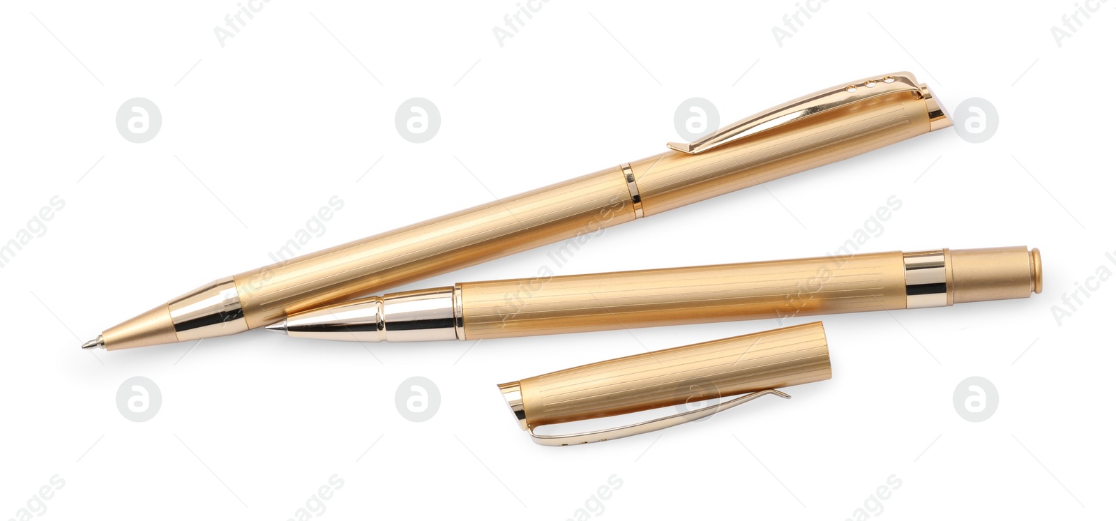 Photo of New stylish golden pens isolated on white, top view