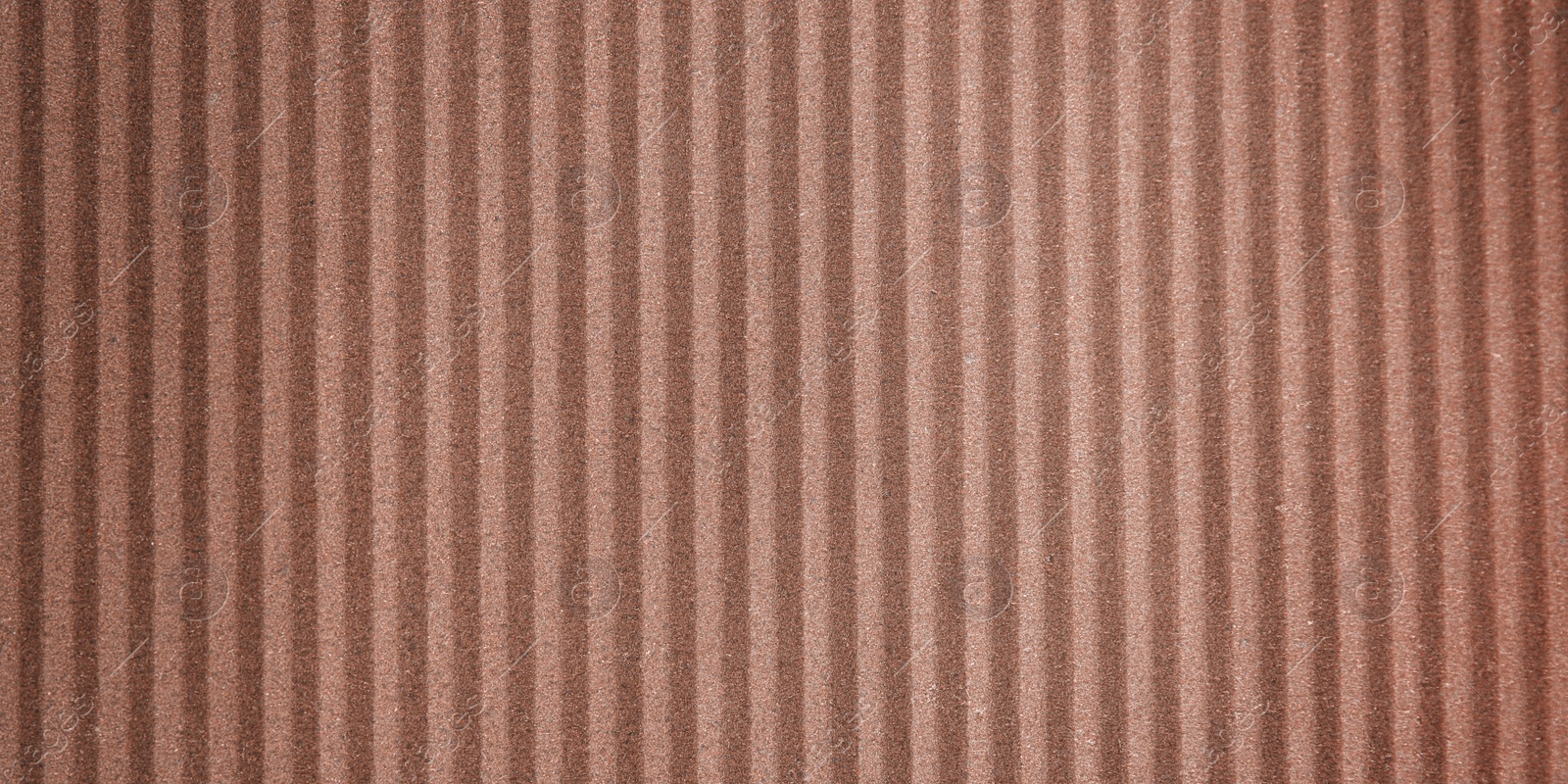 Image of Wall paper design. Brown corrugated sheet of cardboard as background