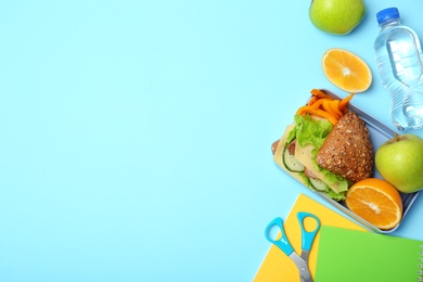 Flat lay composition with healthy food for school child and space for text on color background