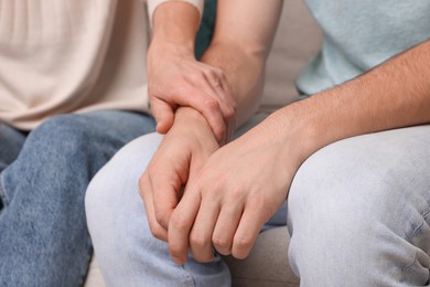 Photo of Mother consoling her son, closeup. Teenager problems