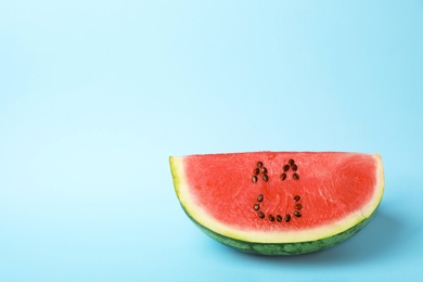 Photo of Watermelon with funny smiling face on color background. Space for text