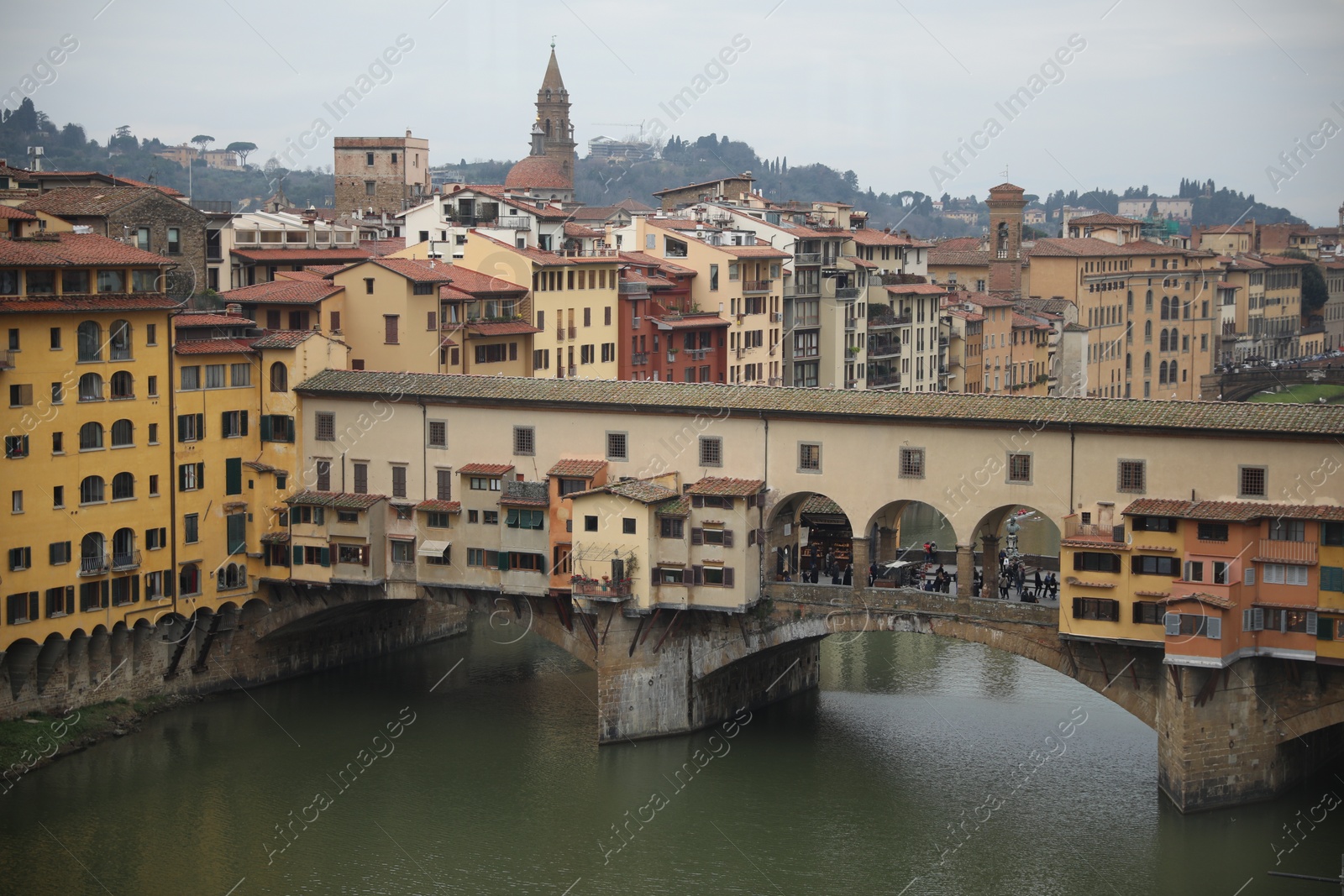 Photo of Florence, Italy - February 8, 2024: Picturesque view of city with beautiful buildings and river