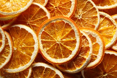 Photo of Many dry orange slices as background, top view